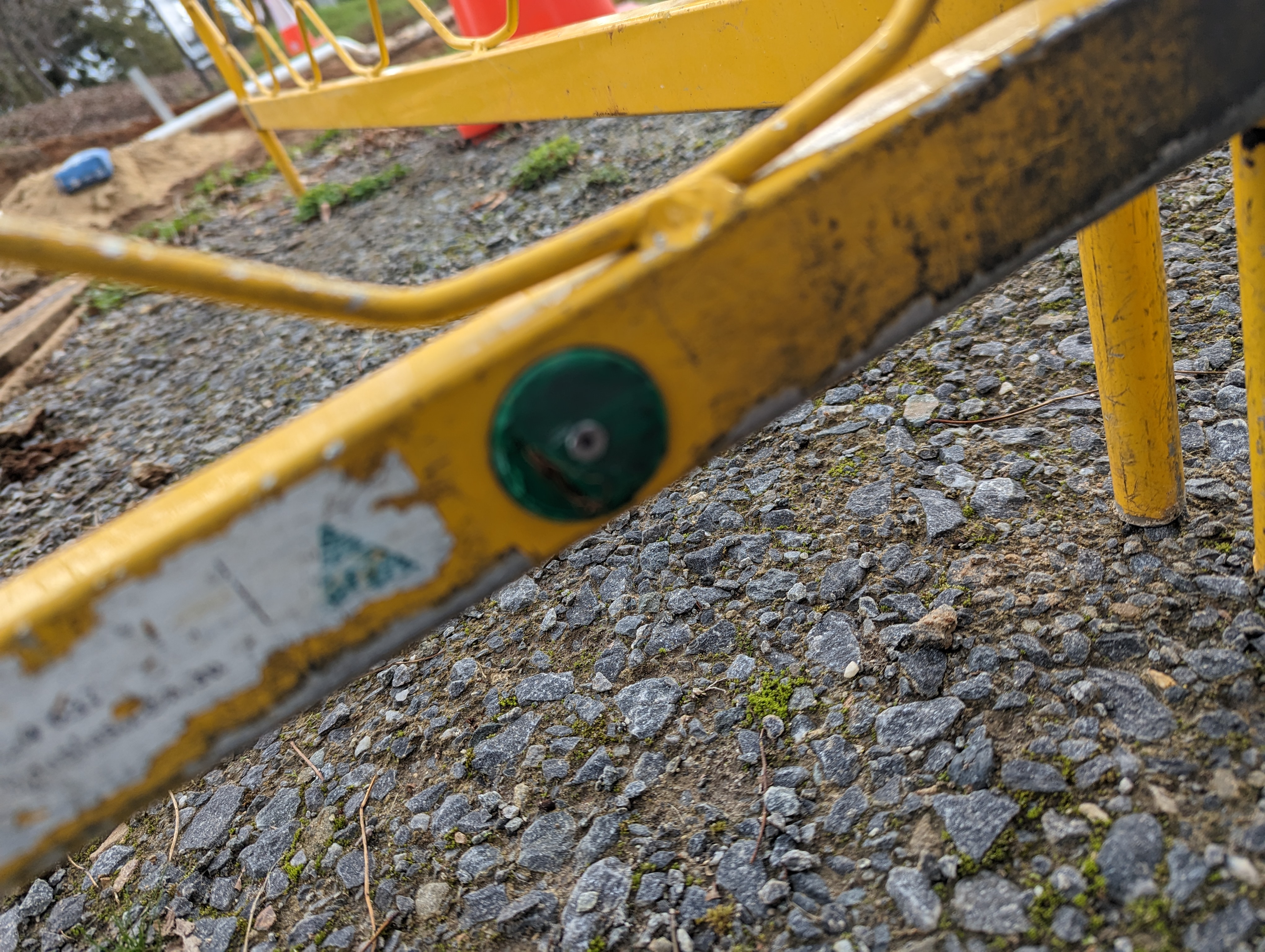 Tag still readable and intact despite heavy dirt and field exposure